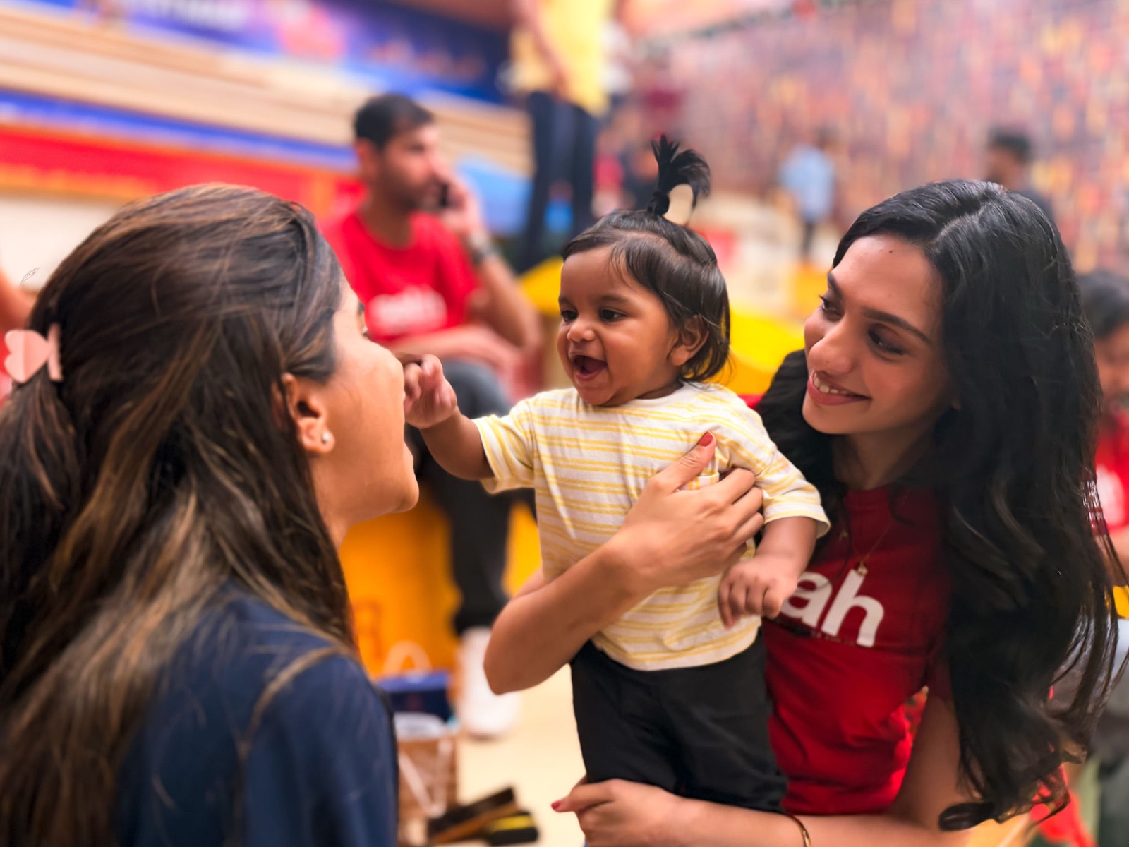 Selah's community delighting over a little one on a Sunday in Mumbai